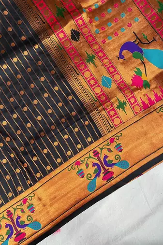 black color rich weaved pallu along polka design zari silk blend saree