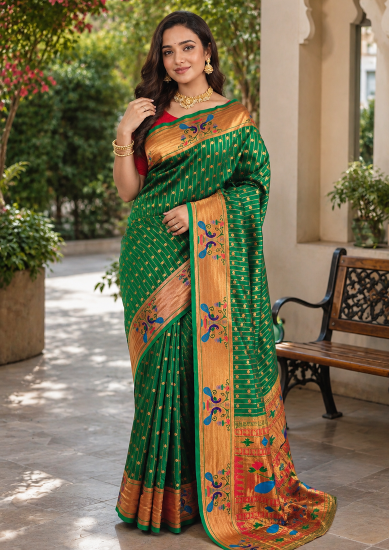 emerald green color rich weaved pallu along polka design zari silk blend saree
