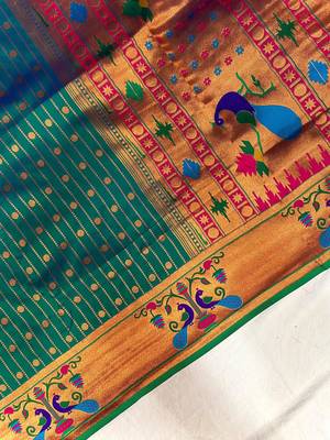 emerald green color rich weaved pallu along polka design zari silk blend saree 3