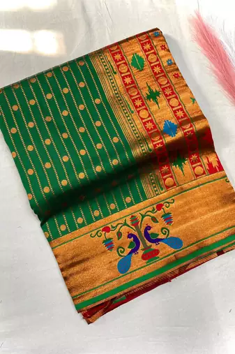 emerald green color rich weaved pallu along polka design zari silk blend saree