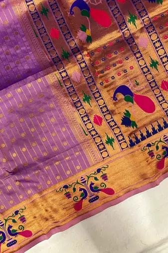 lavender color rich weaved pallu along polka design zari silk blend saree