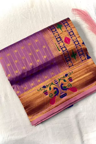 lavender color rich weaved pallu along polka design zari silk blend saree