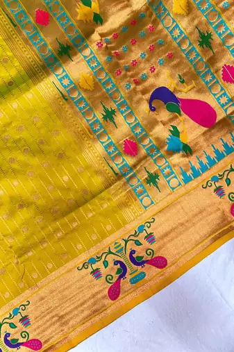 mustard yellow color rich weaved pallu along polka design zari silk blend saree