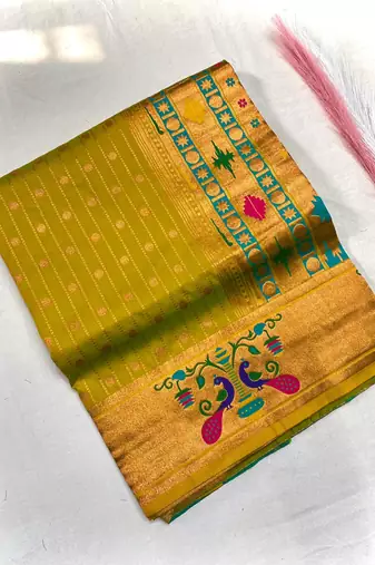 mustard yellow color rich weaved pallu along polka design zari silk blend saree