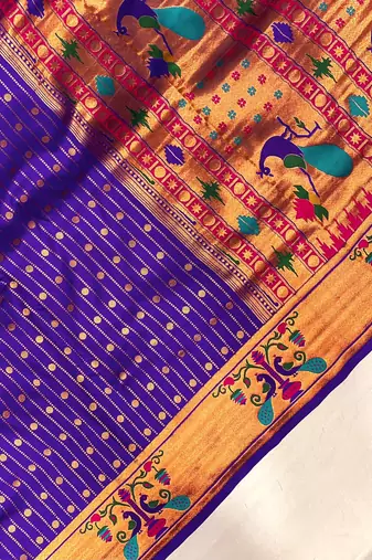 purple color rich weaved pallu along polka design zari silk blend saree