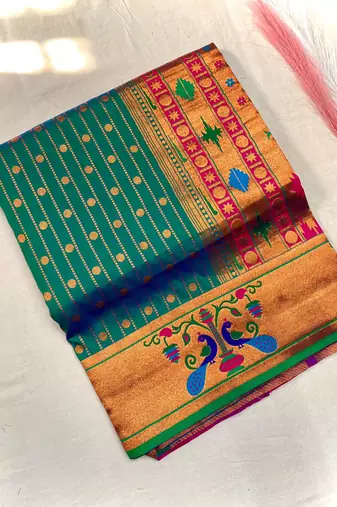 green color rich weaved pallu along polka design zari silk blend saree