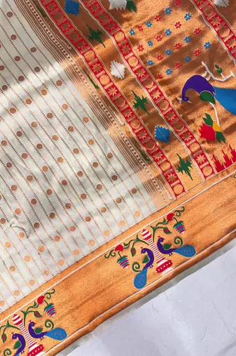 white color rich weaved pallu along polka design zari silk blend saree