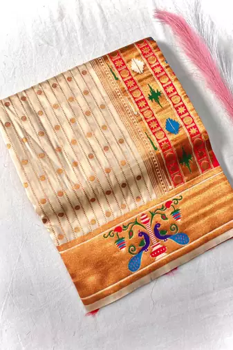 white color rich weaved pallu along polka design zari silk blend saree