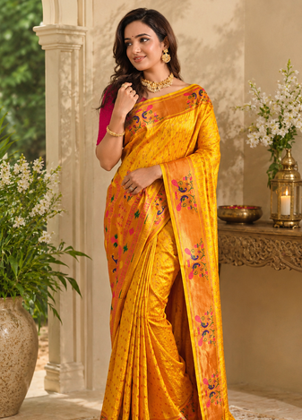 yellow color rich weaved pallu along polka design zari silk blend saree