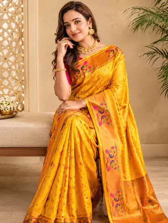 yellow color rich weaved pallu along polka design zari silk blend saree