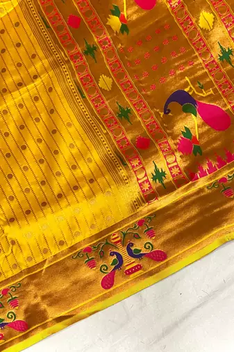 yellow color rich weaved pallu along polka design zari silk blend saree