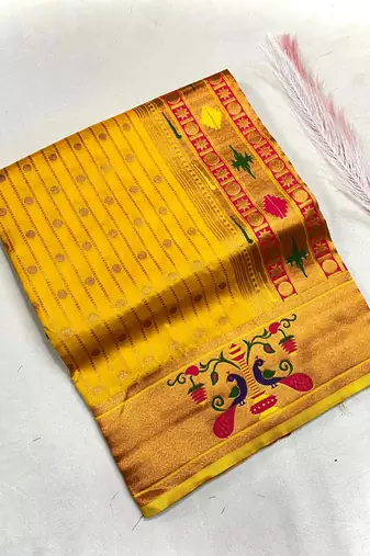 yellow color rich weaved pallu along polka design zari silk blend saree