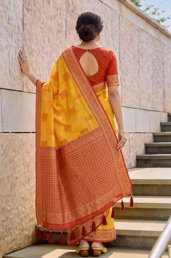 Yellow designer woven saree with matching blouse