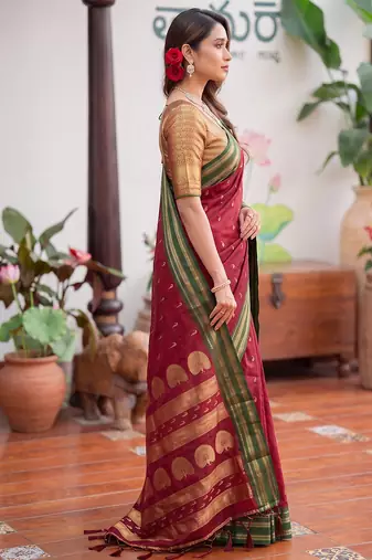 Maroon premium soft silk blend designer saree with zari motifs & rich border
