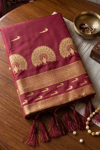 Maroon premium soft silk blend designer saree with zari motifs & rich border