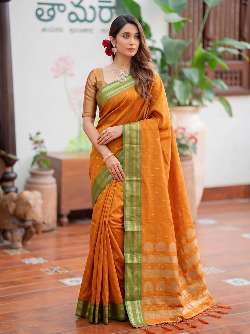 Yellow premium soft silk blend designer saree with zari motifs & rich border