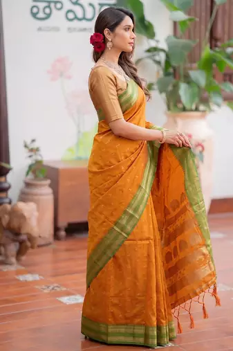 Yellow premium soft silk blend designer saree with zari motifs & rich border