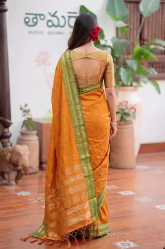 Yellow premium soft silk blend designer saree with zari motifs & rich border