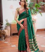 Green premium soft silk blend designer saree with zari motifs & rich border