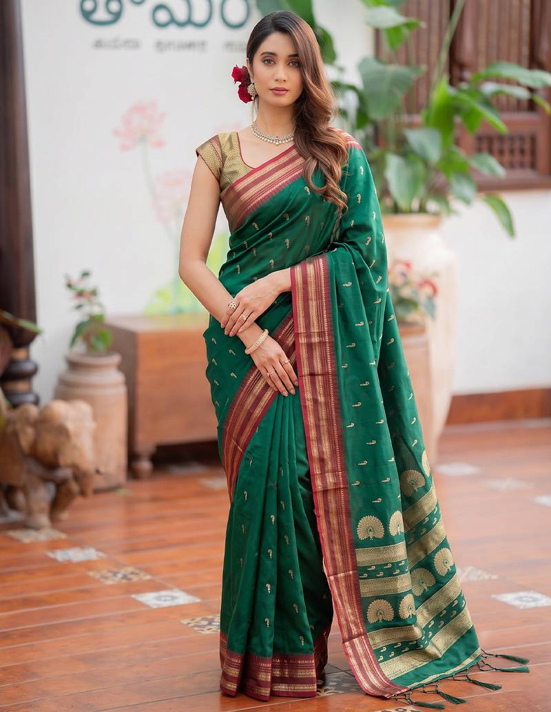 Green premium soft silk blend designer saree with zari motifs & rich border