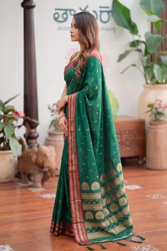 Green premium soft silk blend designer saree with zari motifs & rich border