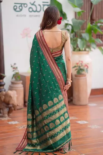 Green premium soft silk blend designer saree with zari motifs & rich border