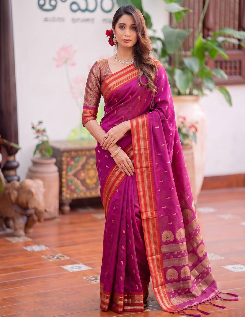Light pink premium soft silk blend designer saree with zari motifs & rich border