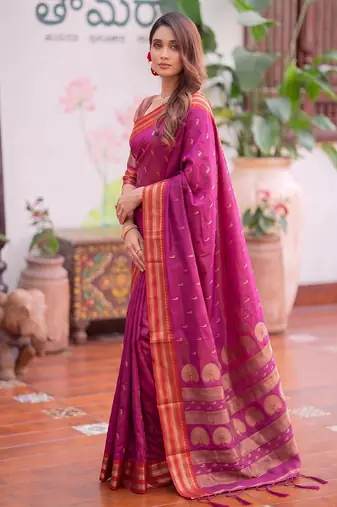 Light pink premium soft silk blend designer saree with zari motifs & rich border