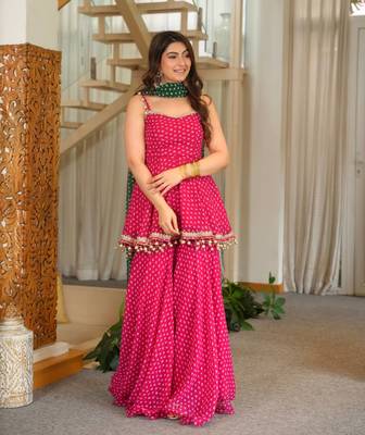 rani pink color heavy bandhej print with fancy lace and hanging latkan work kediya palazzo set 1