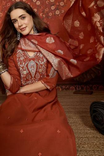 Rust cotton embroidered kurta set.
