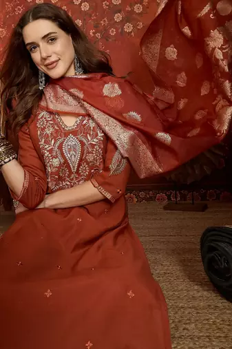 Rust cotton embroidered kurta set.