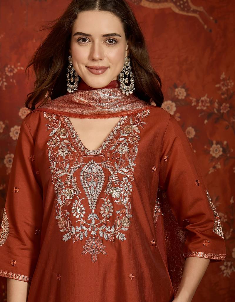 Rust cotton embroidered kurta set.