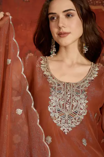 Rust shimmer zari embroidered kurta set.