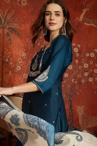 Teal cotton embroidered kurta set.