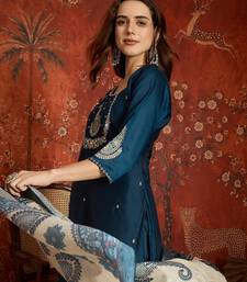 Teal cotton embroidered kurta set.