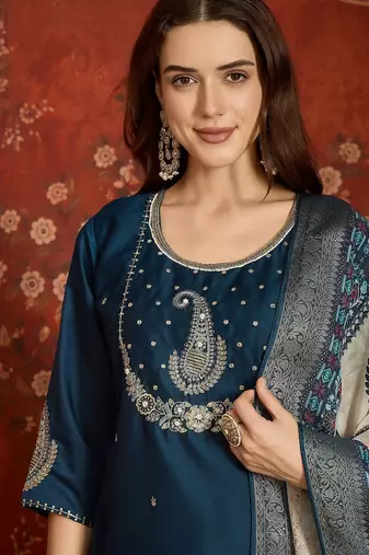 Teal cotton embroidered kurta set.