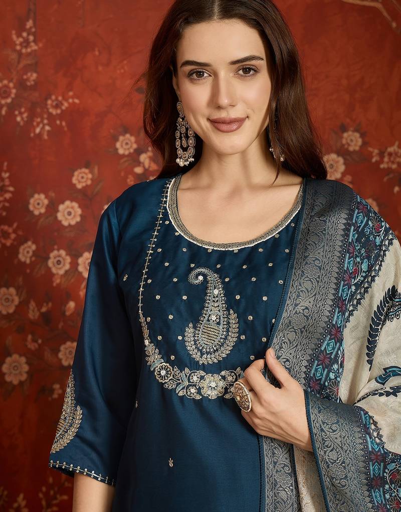 Teal cotton embroidered kurta set.