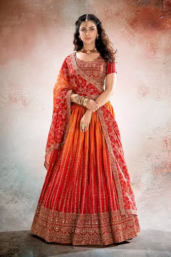 REDISH ORANGE BANDHANI PRINTE WITH SEQUINS ZARI EMROIDERY WORK CHINON LEHENGA CHOLI DUPATTA
