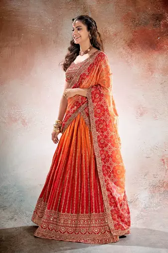 REDISH ORANGE BANDHANI PRINTE WITH SEQUINS ZARI EMROIDERY WORK CHINON LEHENGA CHOLI DUPATTA