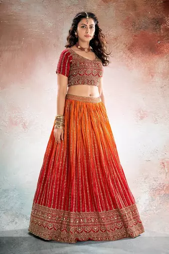 REDISH ORANGE BANDHANI PRINTE WITH SEQUINS ZARI EMROIDERY WORK CHINON LEHENGA CHOLI DUPATTA