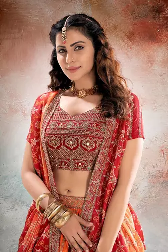 REDISH ORANGE BANDHANI PRINTE WITH SEQUINS ZARI EMROIDERY WORK CHINON LEHENGA CHOLI DUPATTA