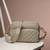   taupe polyester diamond quilted sling bag