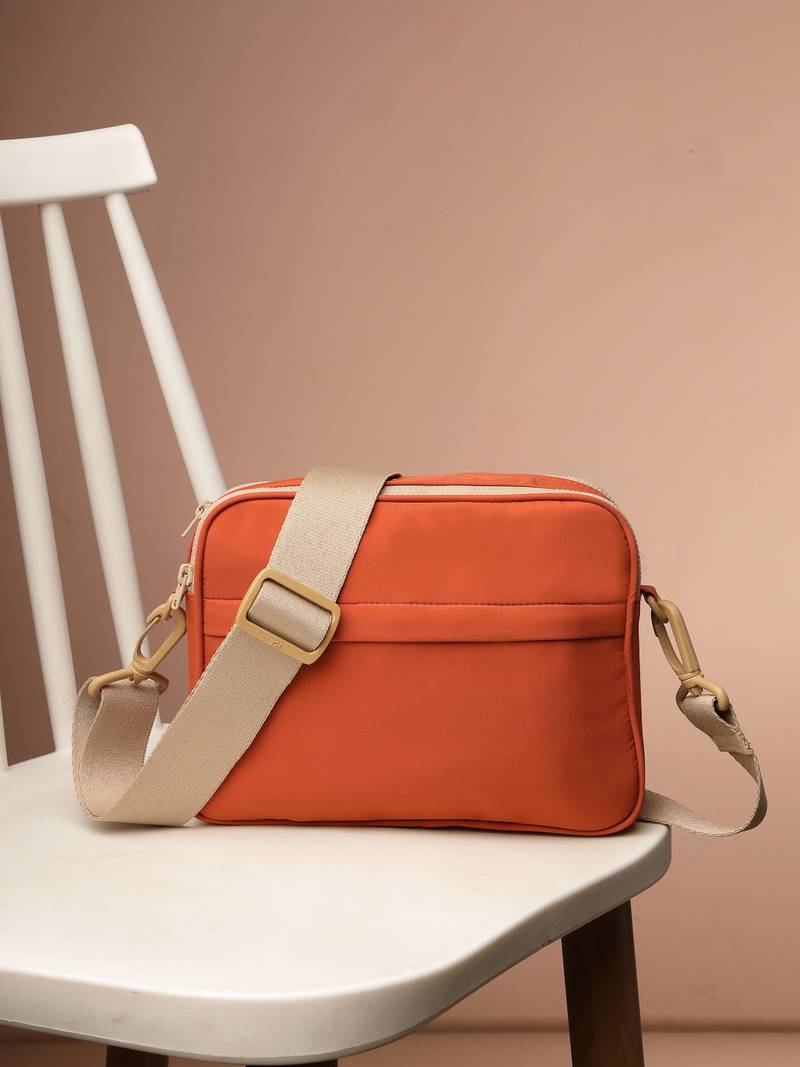   burnt orange polyester solid sling bag