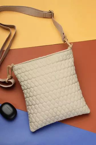  ivory white polyester teardrop quilted sling bag
