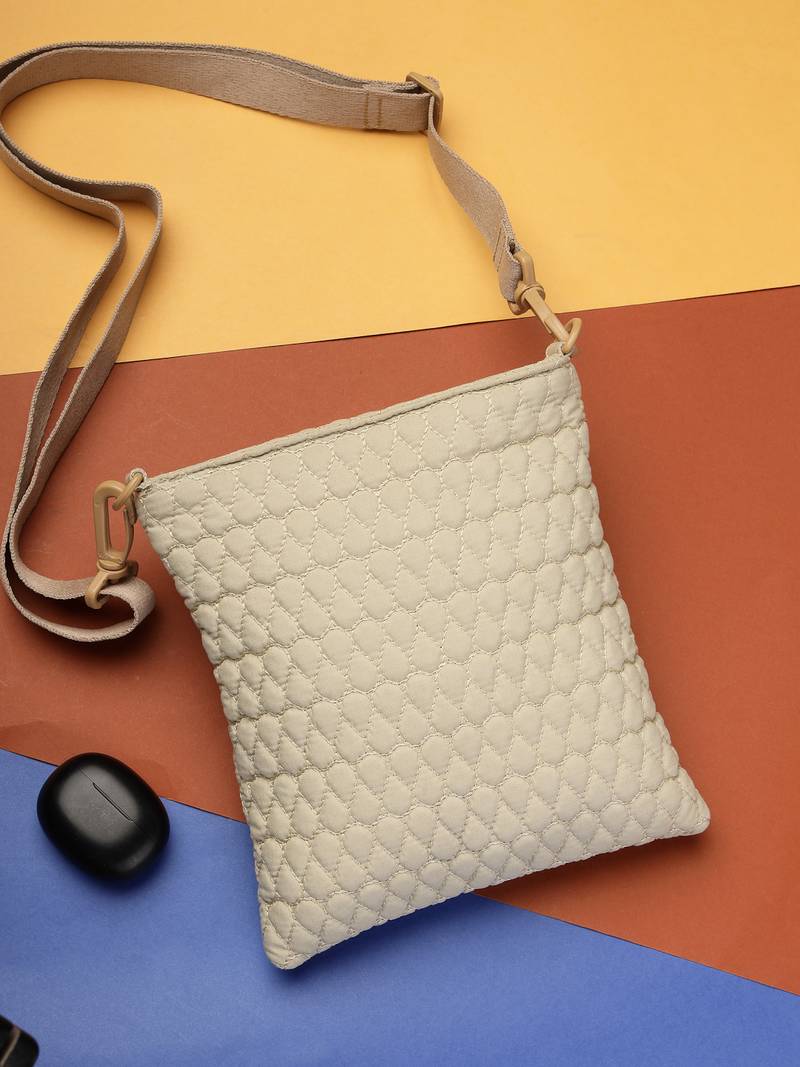   ivory white polyester teardrop quilted sling bag