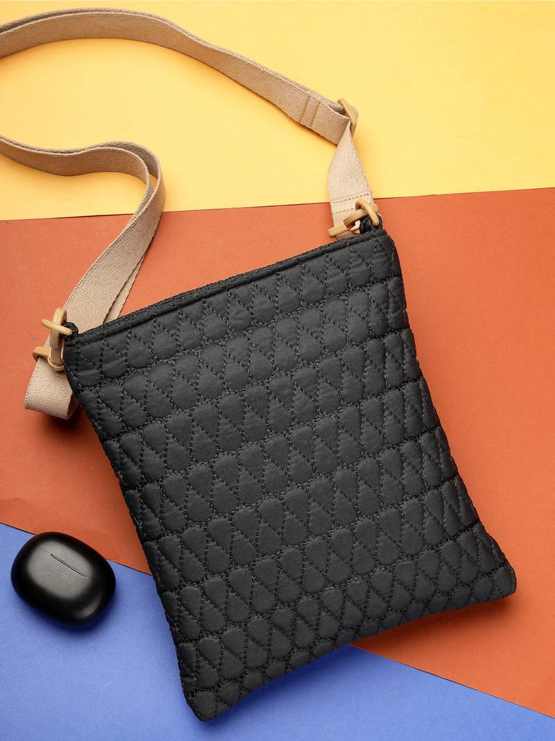   black polyester teardrop quilted sling bag
