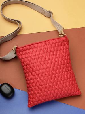   red polyester teardrop quilted sling bag 1