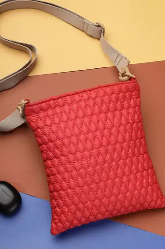   red polyester teardrop quilted sling bag