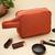   burnt orange polyester travel pouch