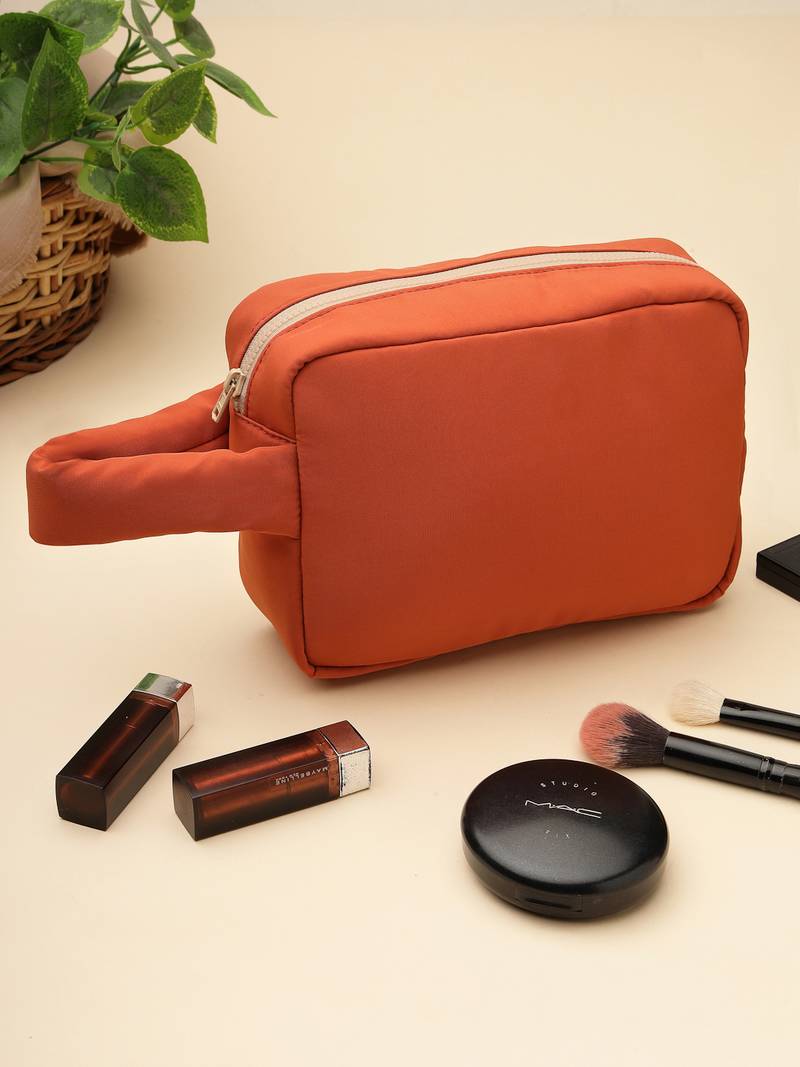   burnt orange polyester travel pouch